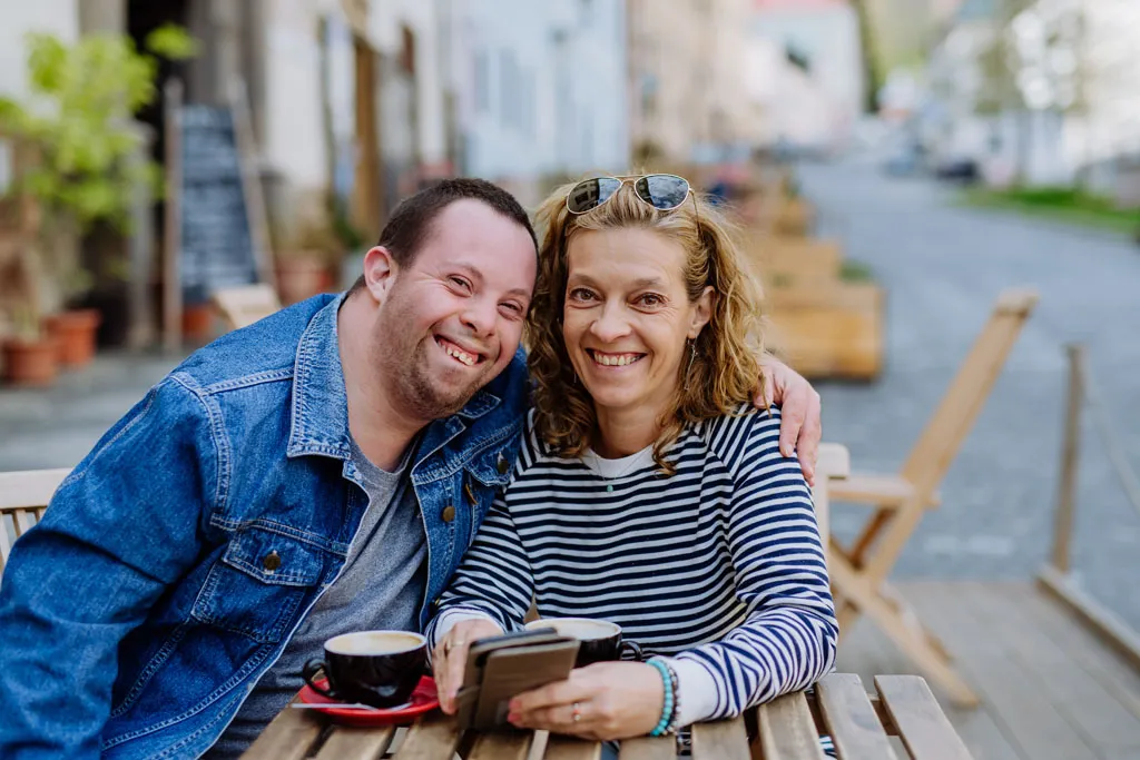 Mom with her son smiling for a photo